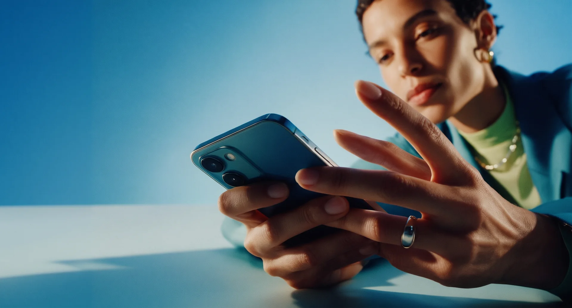 Woman using a smartphone in soft blue light